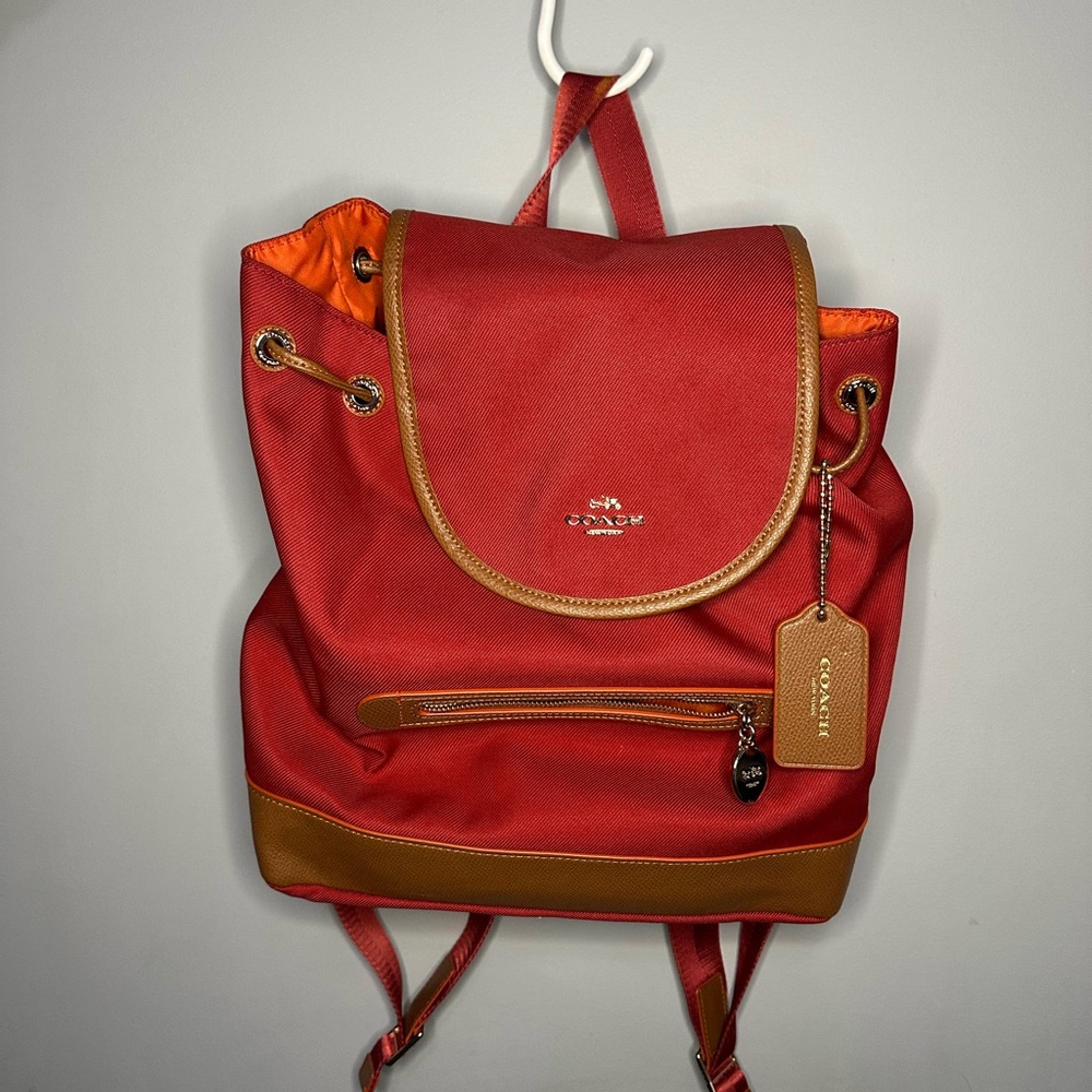 Coach Sawyer Backpack in canvas with a red and saddle leather trim